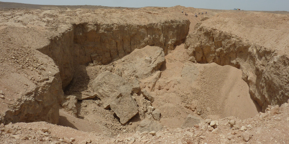 An ancient Egyptian stone quarry at Hatnub. These quarries were sometimes used as jails.