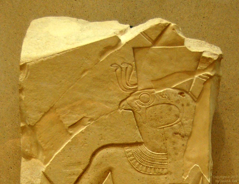 A relief of Montu at Tod with two Wadjet amulets